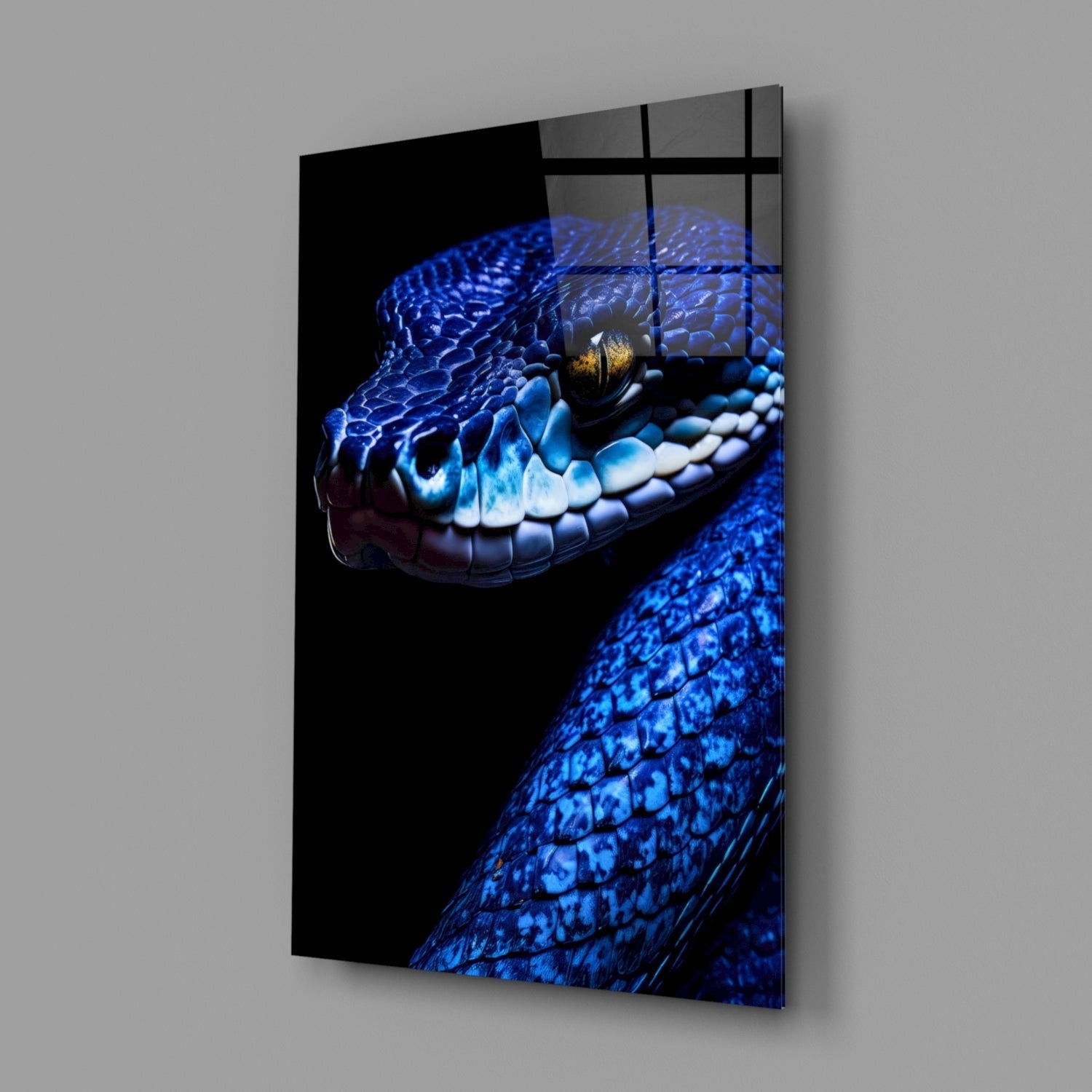 Blue viper glass wall art displayed at an angle, showing the reptile's head with golden eye and scaled texture against black background.