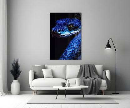 Blue viper glass wall art displayed above white sofa in modern living room setting.
