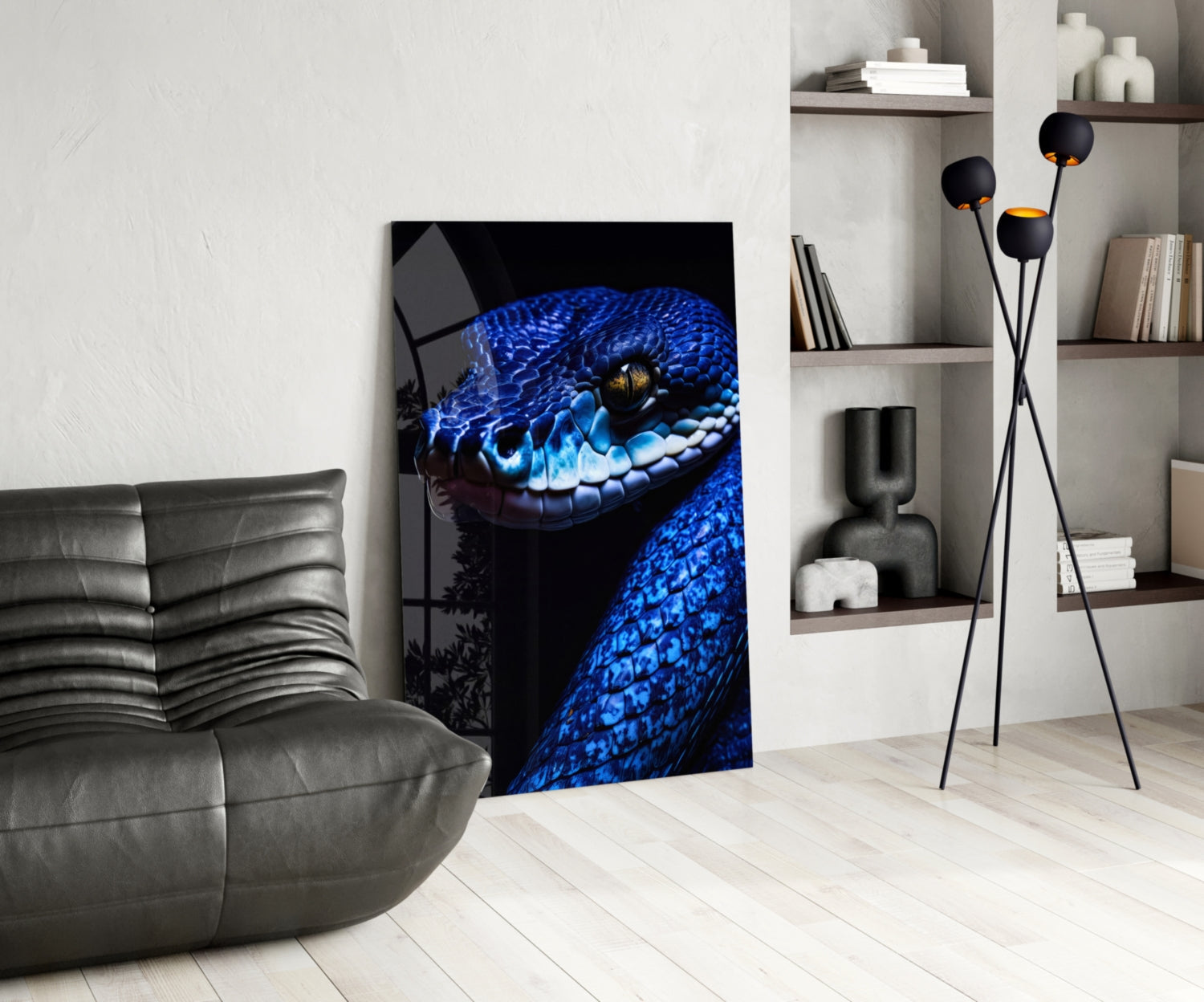 Blue viper glass wall art displayed in modern living room with gray sofa, shelving, and decorative accessories.