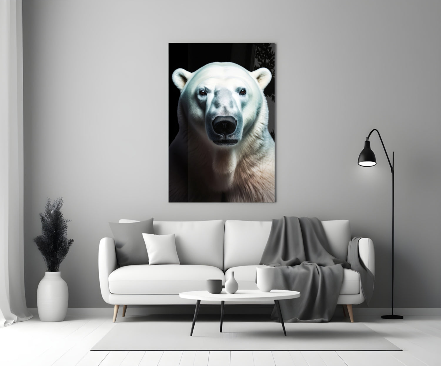 Polar bear portrait glass wall art displayed above a white sofa in a minimalist living room setting.