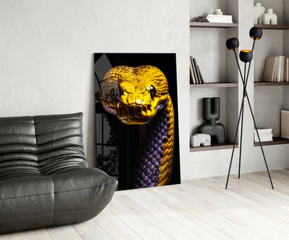Golden and purple snake head glass wall art displayed in modern living room with gray sofa and white shelving.