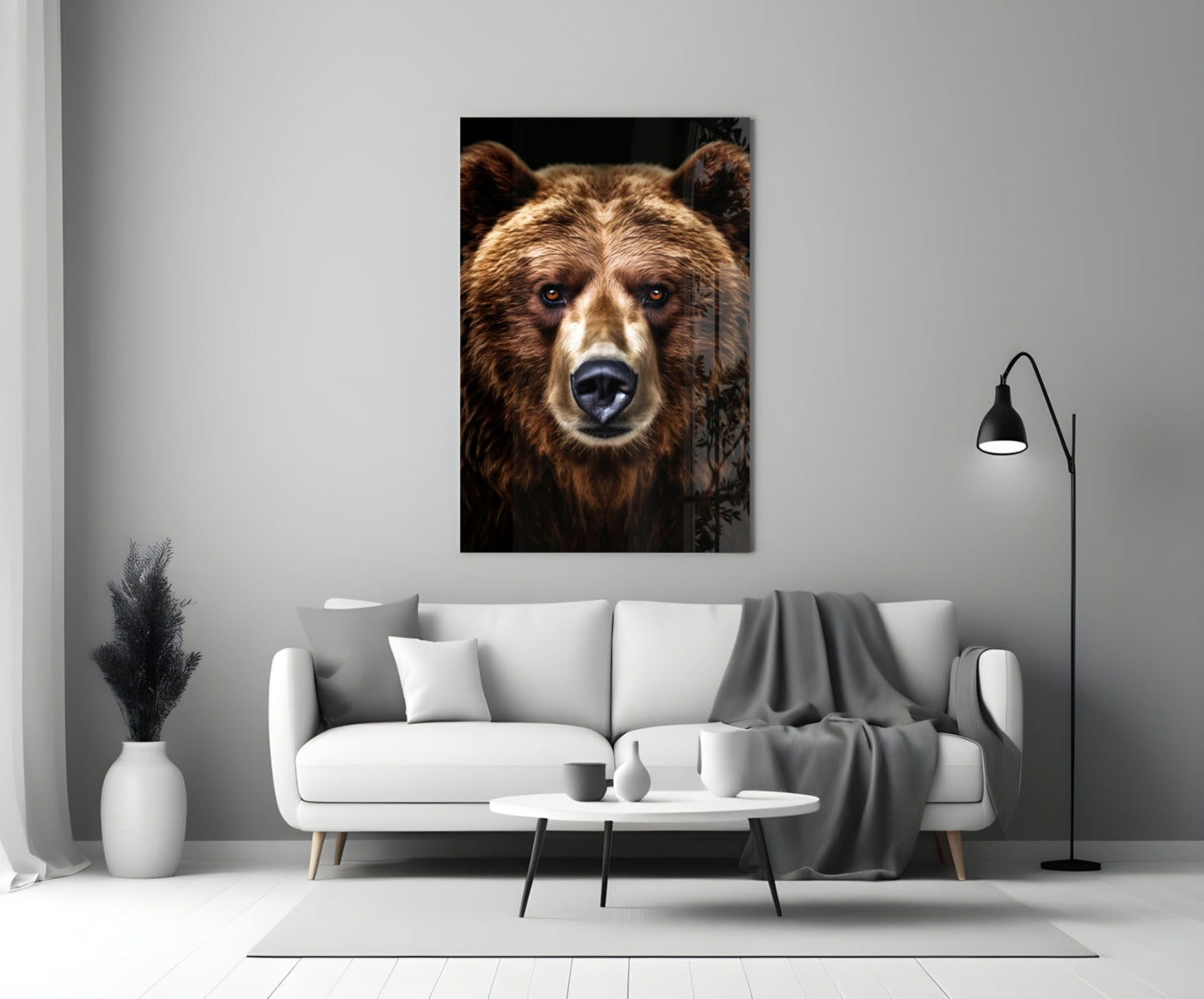 Bear glass wall art displaying close-up brown bear face with white markings against black background, mounted above white sofa in modern living room.