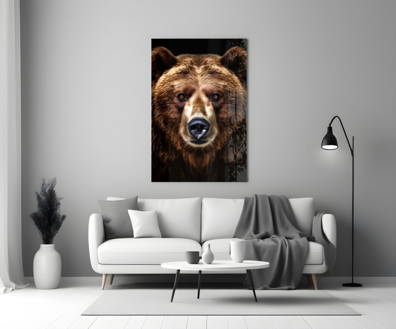 Bear glass wall art displaying close-up brown bear face with white markings against black background, mounted above white sofa in modern living room.