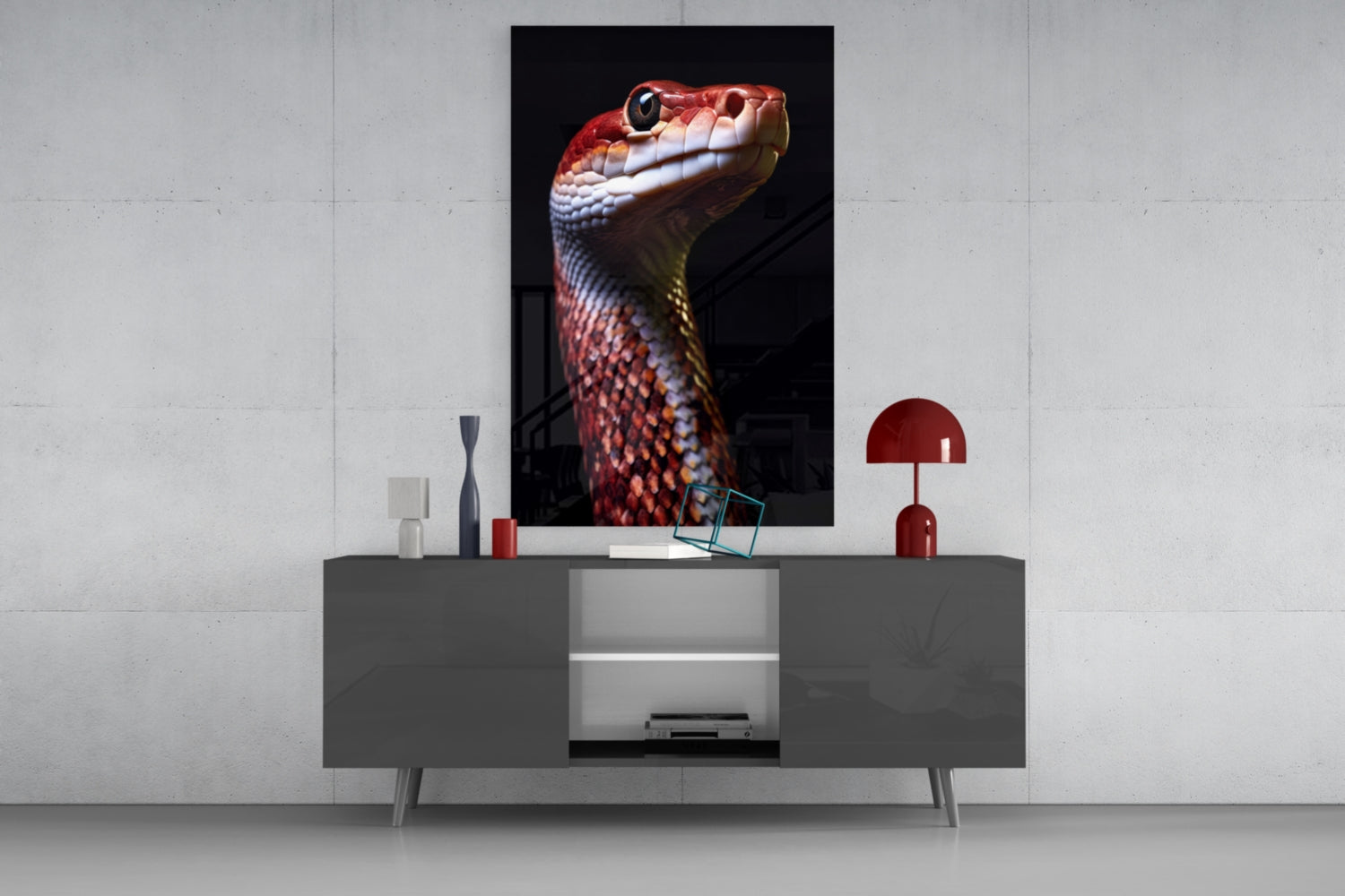 Red and white serpent head glass wall art displayed above gray console table with decorative accessories in modern interior setting.