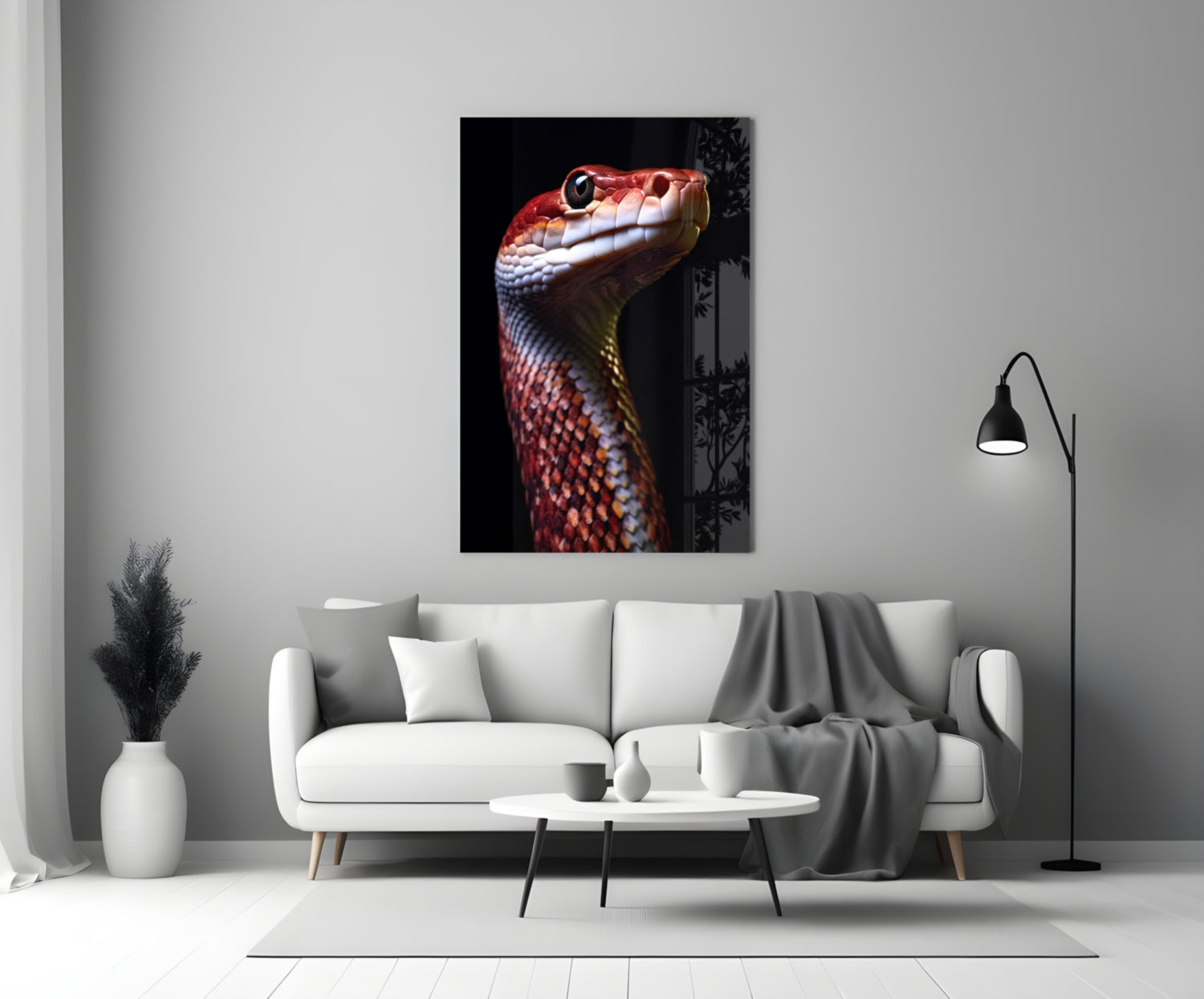 Red and white serpent head portrait on black background displayed on living room wall above white sofa.