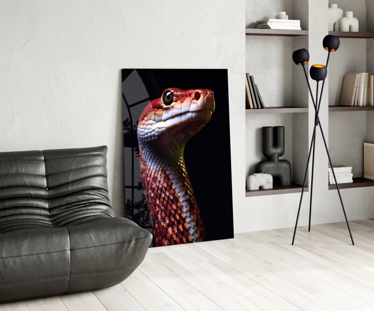 Glass wall art featuring a red and yellow serpent's head in profile against black background, displayed in modern living room setting.