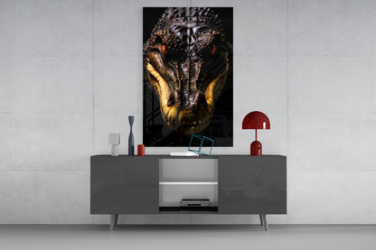 Modern living room setup featuring a dark gray media console with a mounted glass wall art displaying a close-up reptile portrait with gold and black coloring.