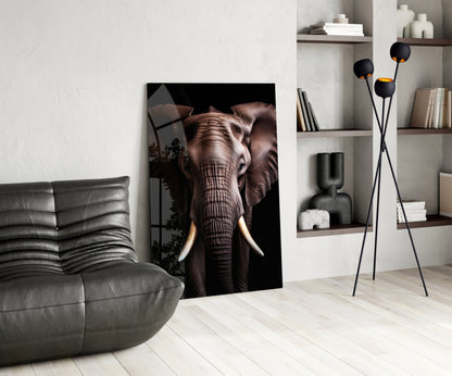 Modern living room interior featuring a large glass wall art of an elephant with ivory tusks against black background, displayed next to a gray leather chair and wooden shelving unit.