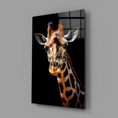 Giraffe glass wall art mounted on gray wall, displaying front-facing giraffe portrait against black background with visible grid pattern on glass surface.