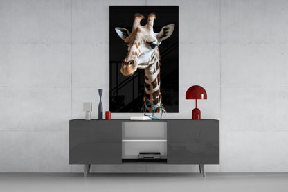 Light-colored giraffe portrait glass wall art displayed above a gray media console with red decorative lamp and accessories.
