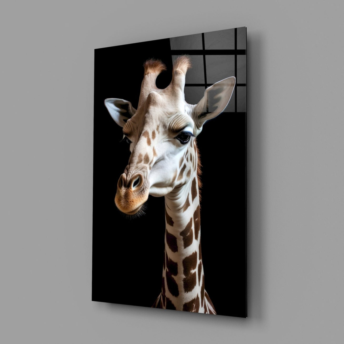 Angled product shot of mounted glass wall art displaying a light tan giraffe head against black background with window grid reflection visible.