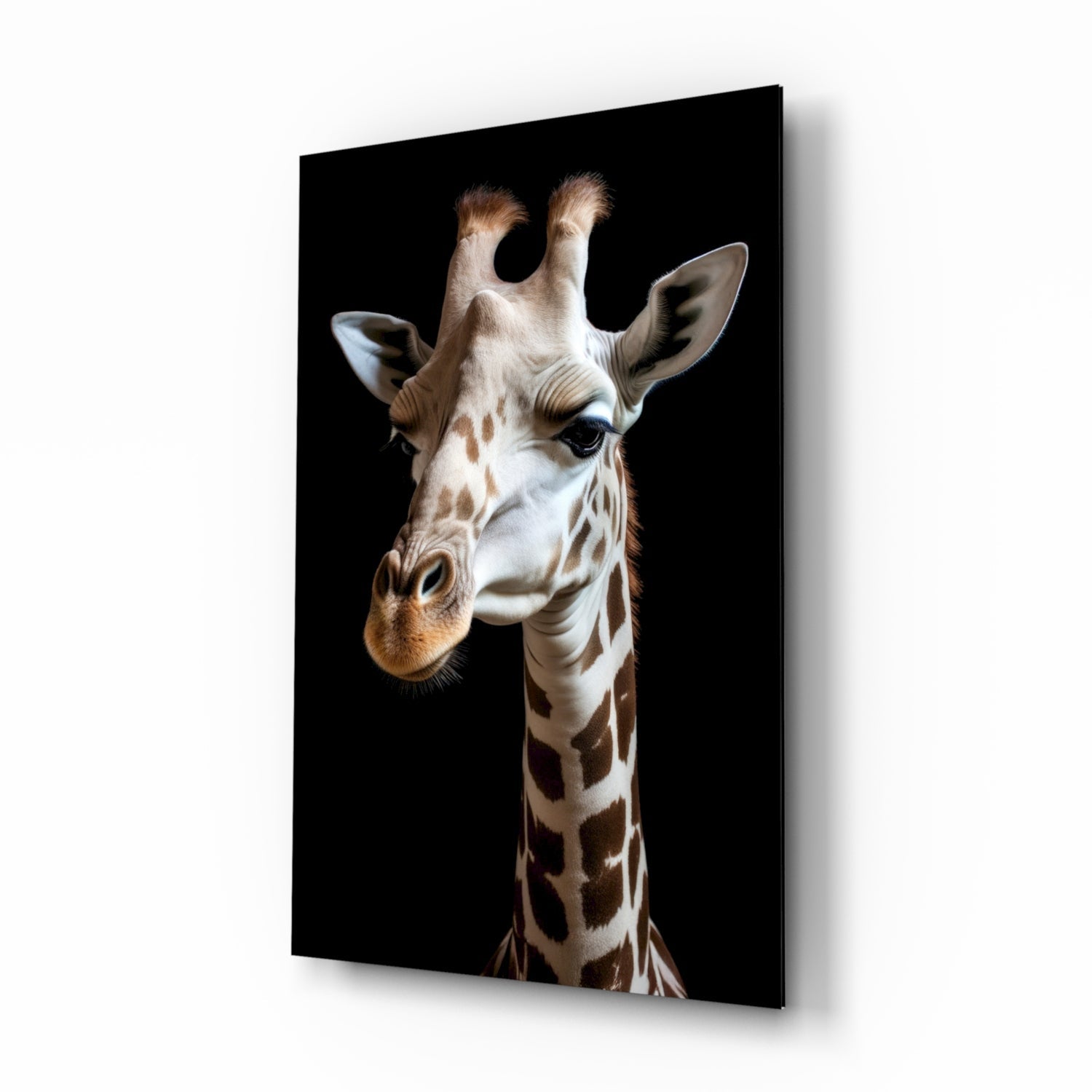 Light-colored giraffe with brown spots facing left against black background, displayed as angled glass wall art panel.