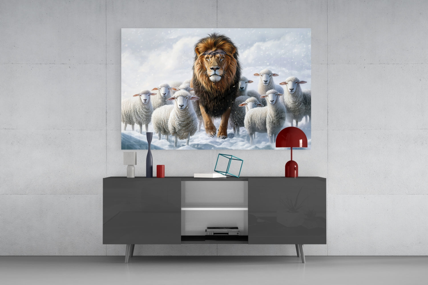 Glass wall art depicting a lion surrounded by white sheep in a snowy landscape, displayed above a dark modern console table with red decorative accessories.