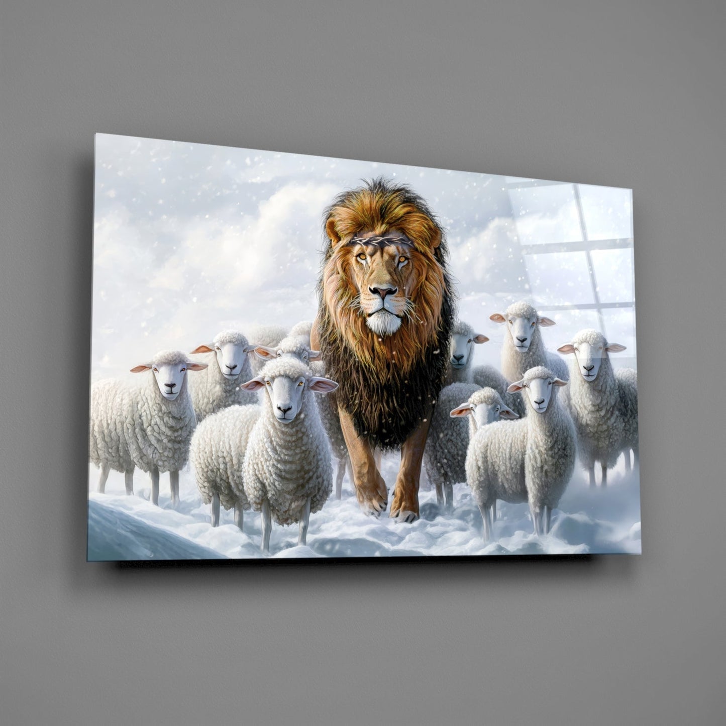 A majestic lion surrounded by white sheep in a snowy landscape on a glass wall art panel displayed against a gray wall.