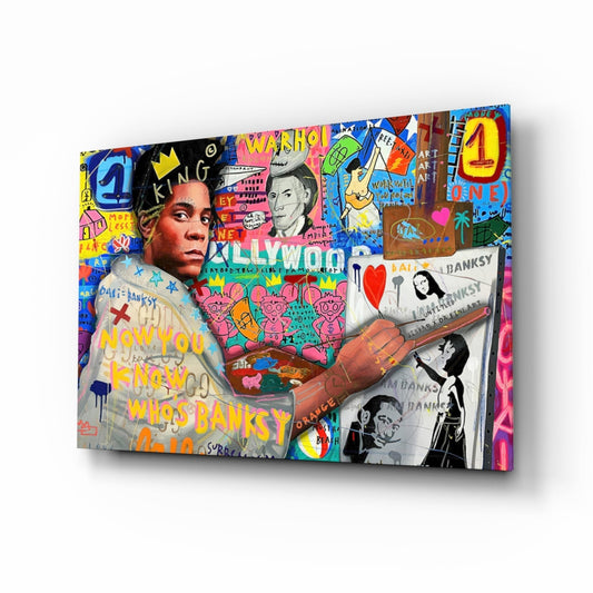 Angled perspective of colorful graffiti glass wall art featuring portrait, crowns, text, and mixed media collage elements in vibrant blues, pinks, and yellows.