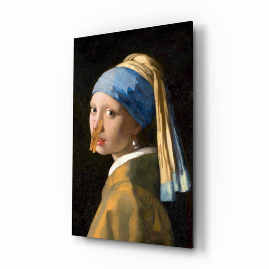 Glass wall art featuring a girl with a blue headwrap and golden earring in profile against a dark background.