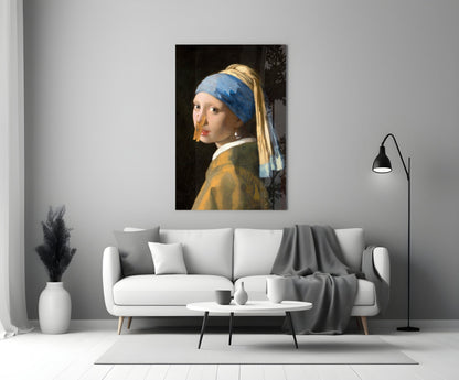 Girl with blue headwrap and gold earring hangs on clothespin glass art above white sofa in modern living room.