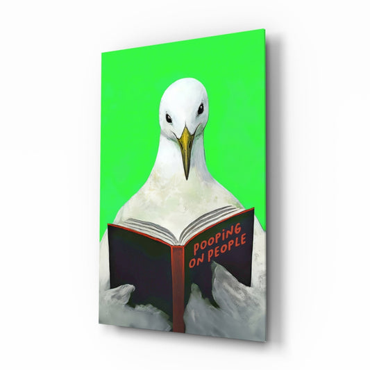 White seagull reading black book titled "Pooping On People" against bright green background on glass wall art panel.