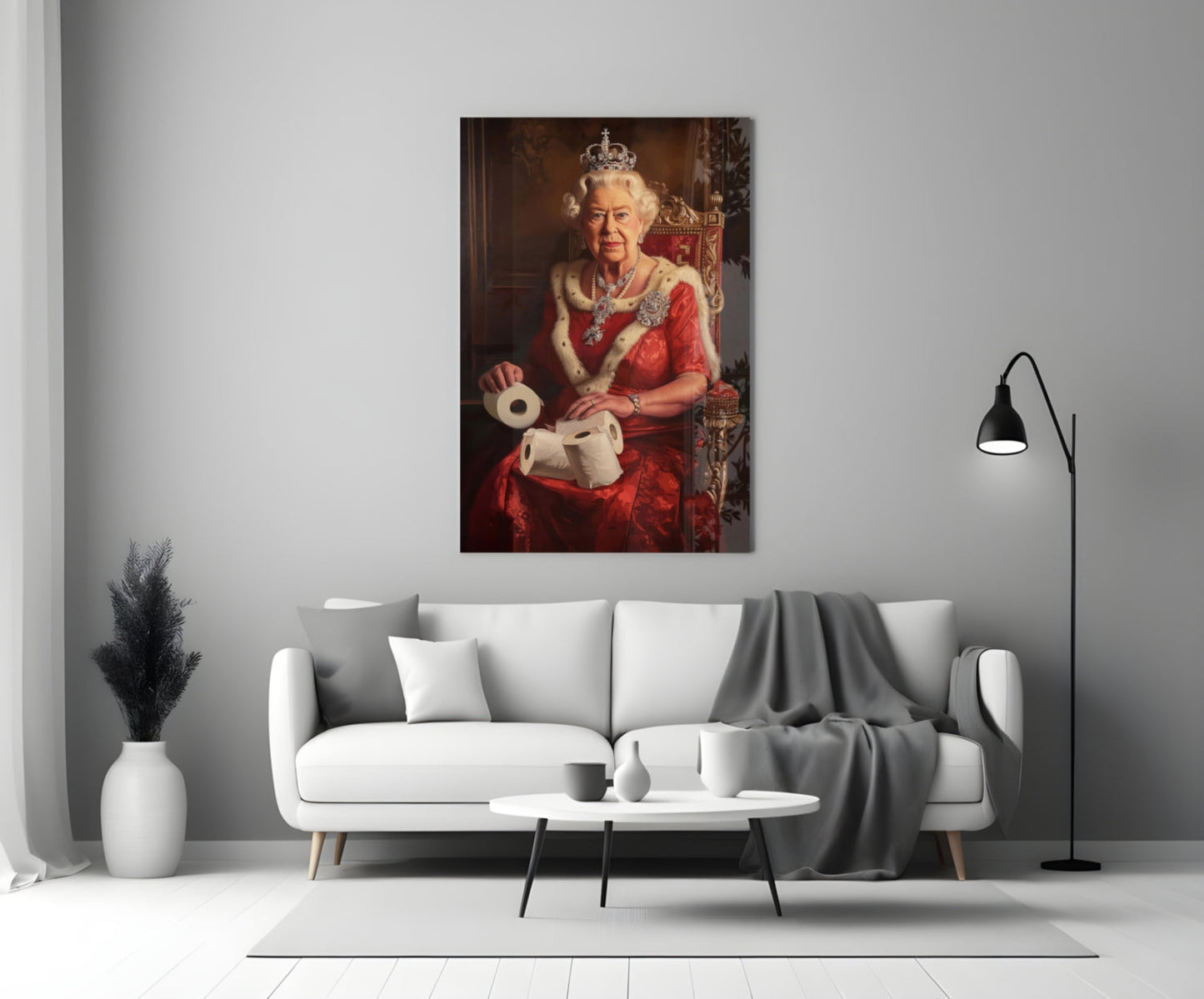 Glass wall art depicting a figure in red regalia and crown holding toilet paper rolls, displayed above a white sofa in a modern living room.