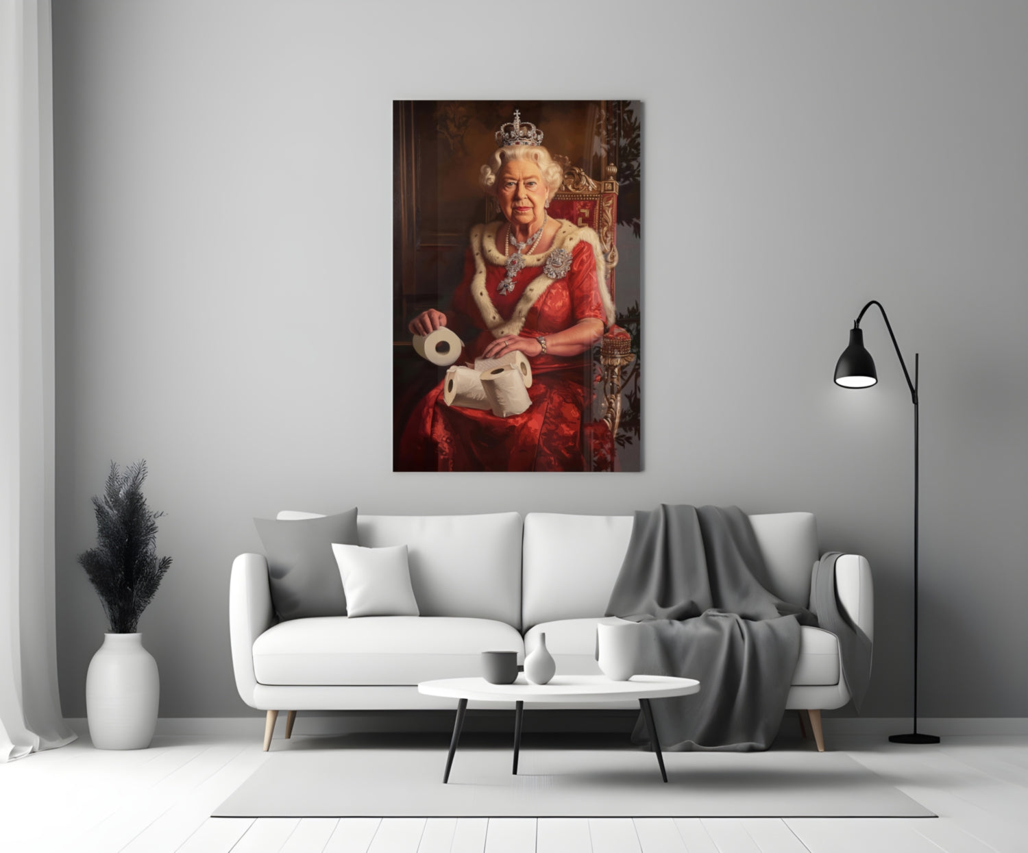 Glass wall art depicting a figure in red regalia and crown holding toilet paper rolls, displayed above a white sofa in a modern living room.