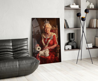 Glass wall art depicting a seated figure in red ceremonial dress with crown, displayed in a modern living room next to gray furniture.