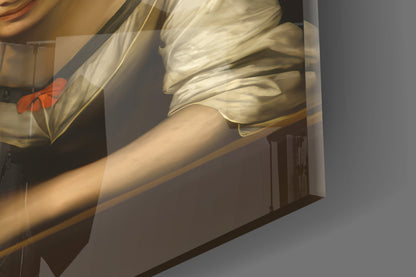 Close-up angled view of glass wall art showing draped cream fabric, bare arm, and red flower detail against dark background.