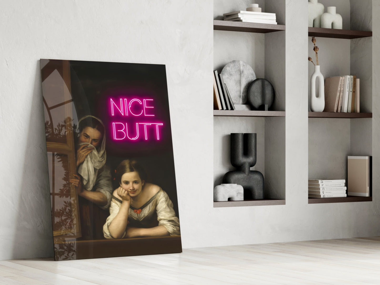 Classical portrait painting with neon pink "NICE BUTT" text leaning against white wall beside shelving unit.