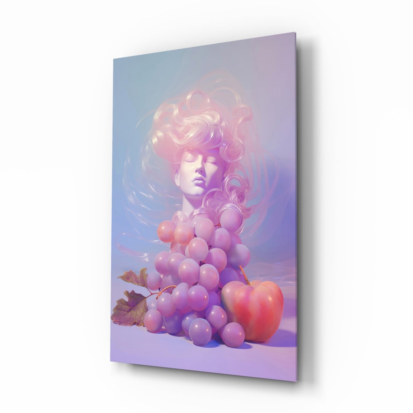 Angled view of glass wall art showing sculptural female head with pink wavy hair above clustered purple grapes and red apple on gradient purple-blue background.