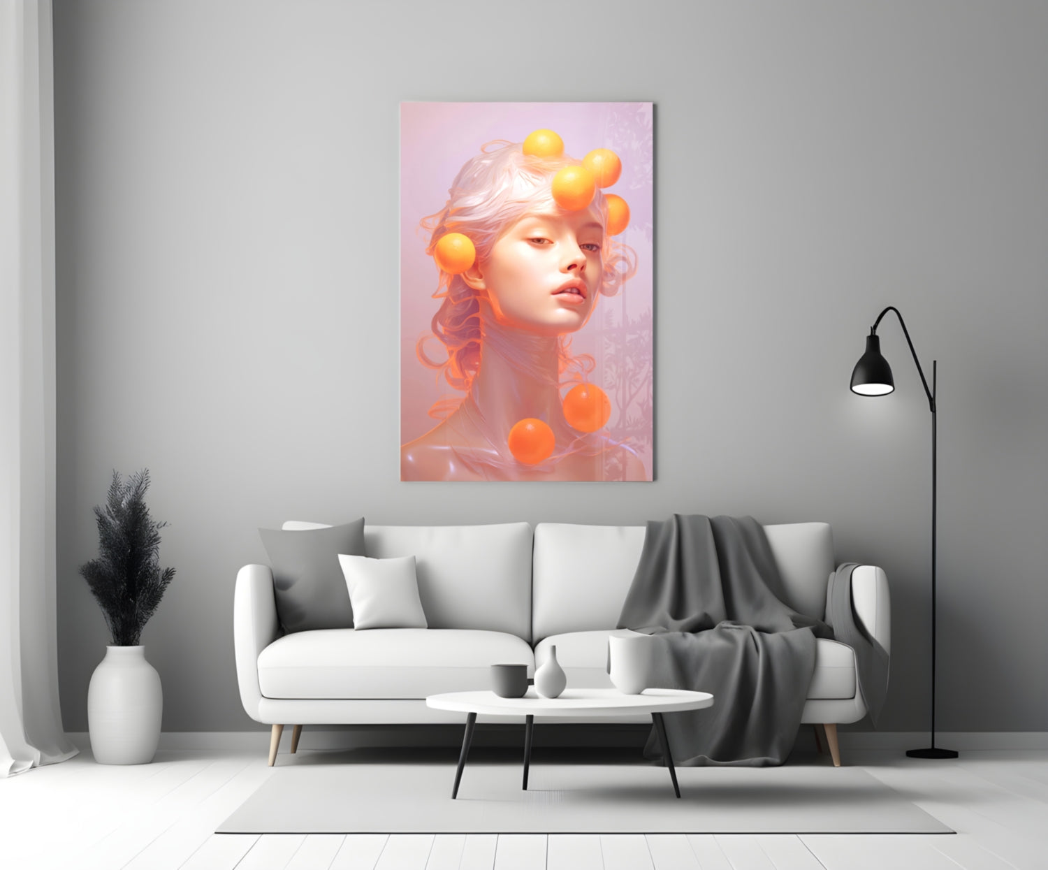Queen of Orange glass wall art displayed above a white sofa in a minimalist living room setting.