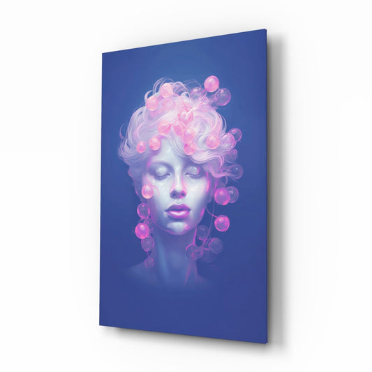 Angled perspective of glass wall art showing serene face with closed eyes, curly hair, and glowing pink bubbles against deep blue background.