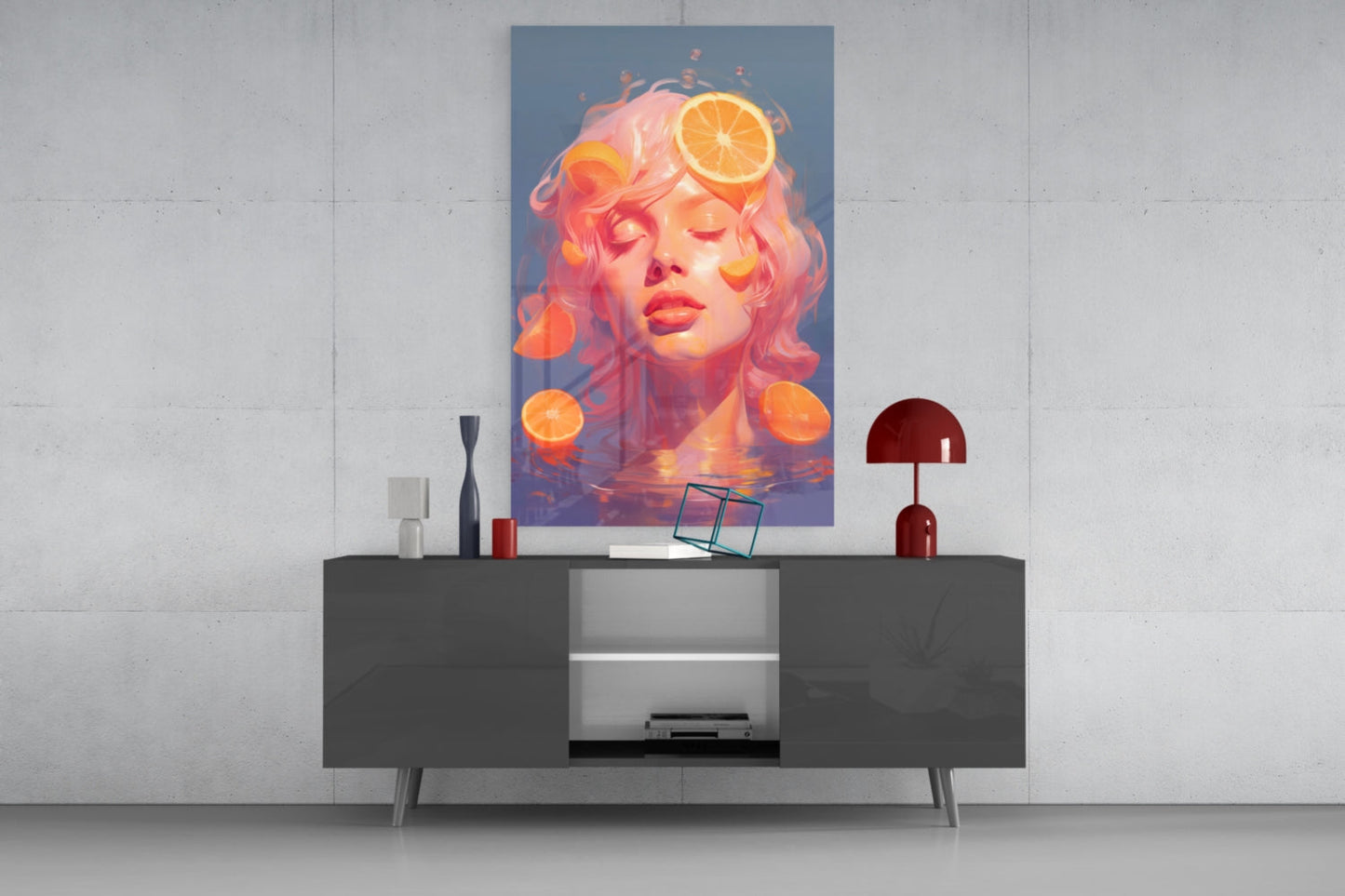Modern living room interior with contemporary dark console table displaying orange slice artwork above, flanked by red lamp and decorative objects.