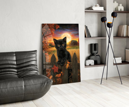 Autumn Cat glass wall art leaning against white wall in modern living room with gray sofa and shelving.