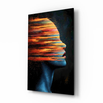 Glass wall art featuring a blue silhouetted profile with a vibrant orange and red sunset landscape filling the head, displayed at an angle against white background.