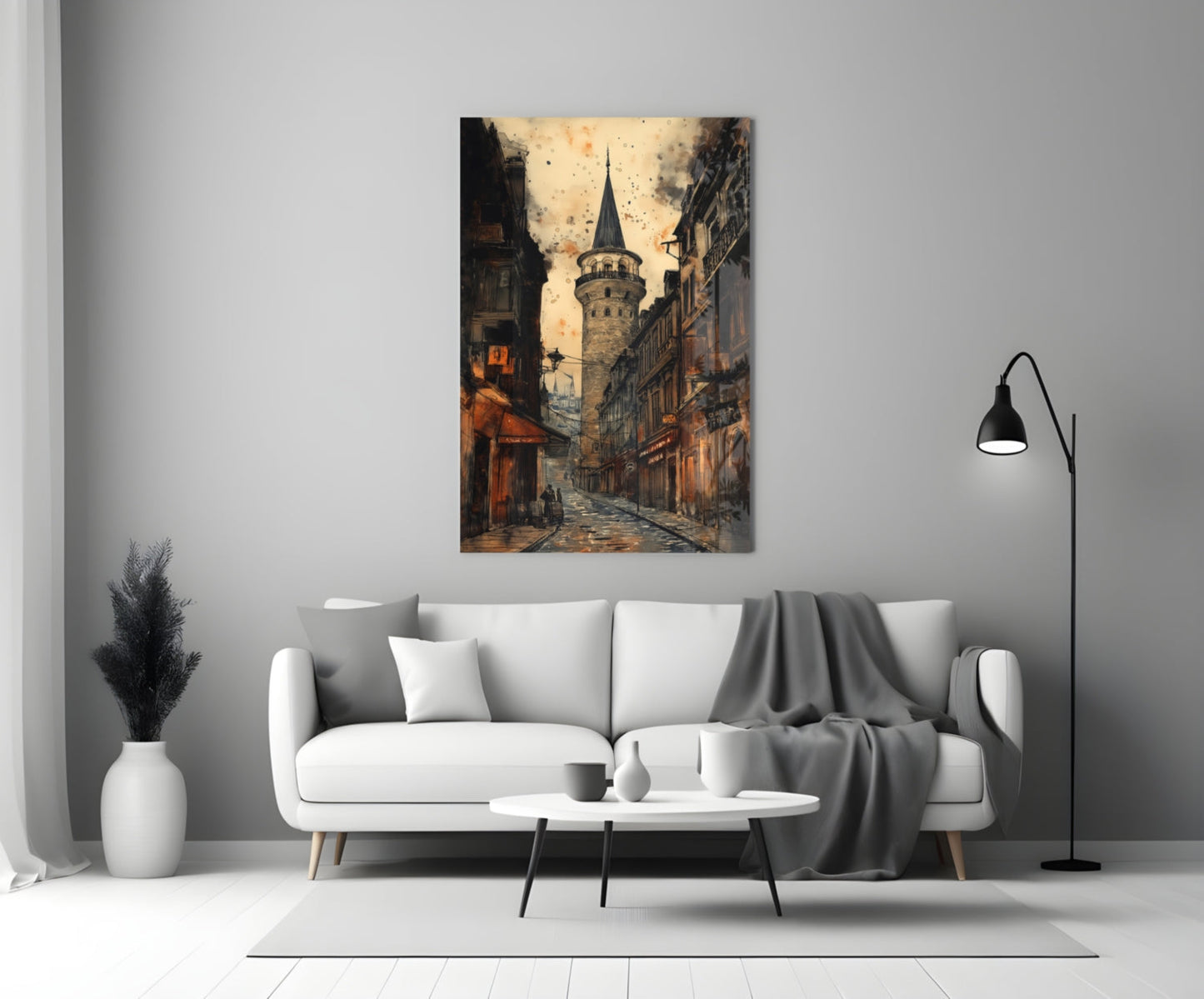 Galata Street Glass Wall Art hanging above white sofa in modern living room, showing historic tower street scene in warm sepia tones.