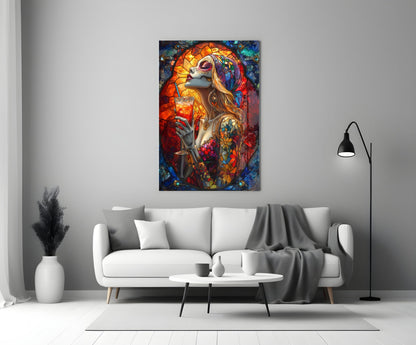 Vibrant stained glass wall art depicting a skull-faced woman in orange and blue tones, displayed above a white sofa in a modern living room.