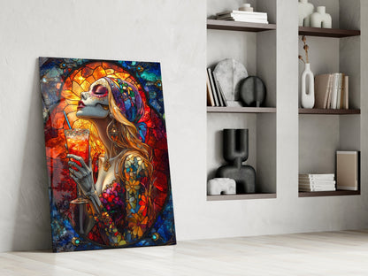 Colorful stained glass art depicting a woman with long hair and ornate floral tattoos holding a cocktail, leaning against white shelving unit.