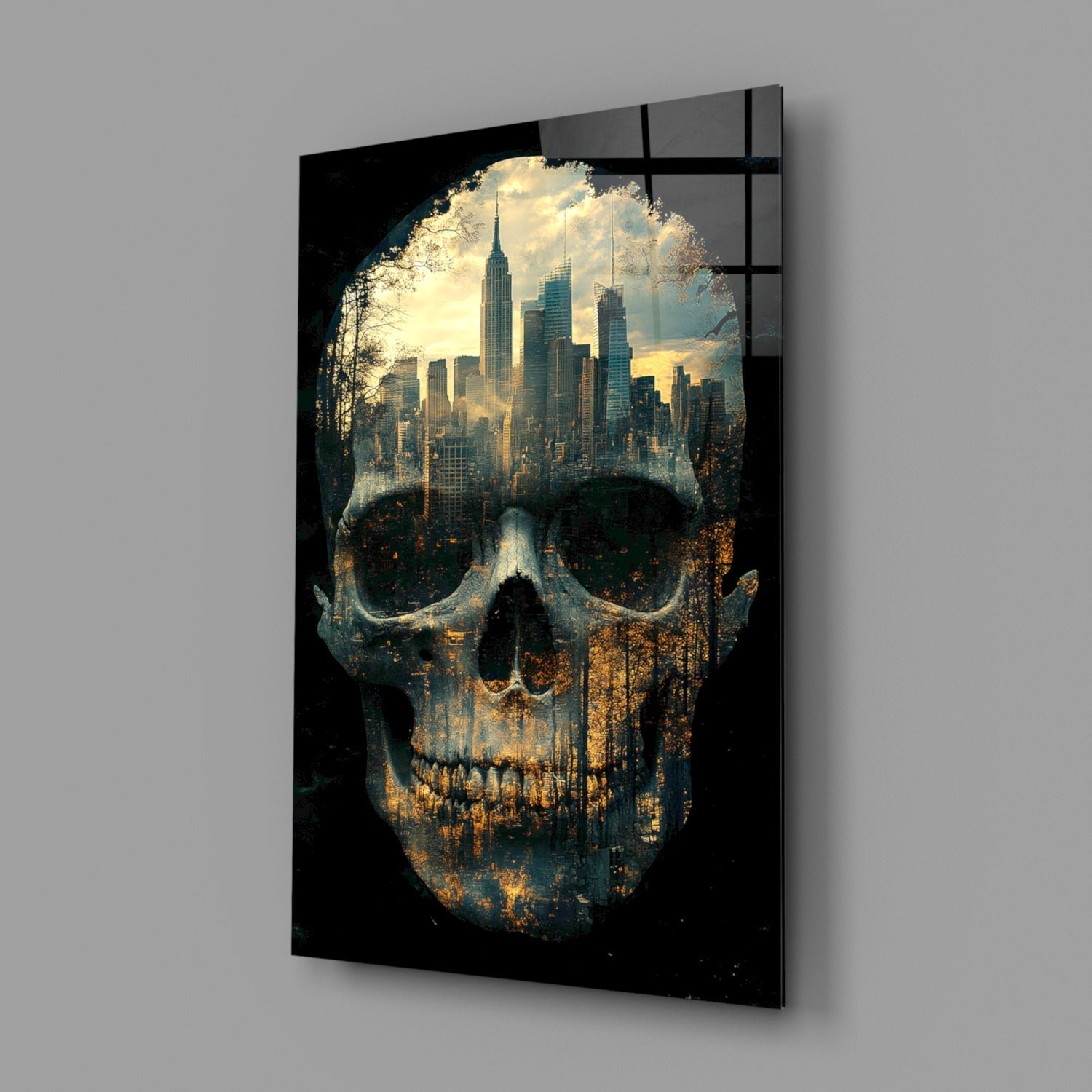 Black glass panel displaying double-exposure skull with cityscape skyline visible through eye sockets, mounted on gray wall.