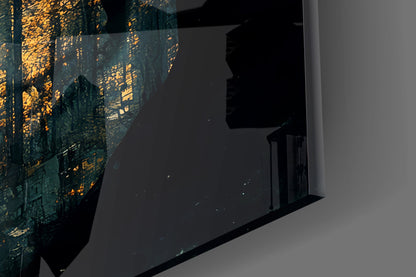 Close-up angled view of teal glass wall art with gold leaf detailing and skull design, mounted on white wall.