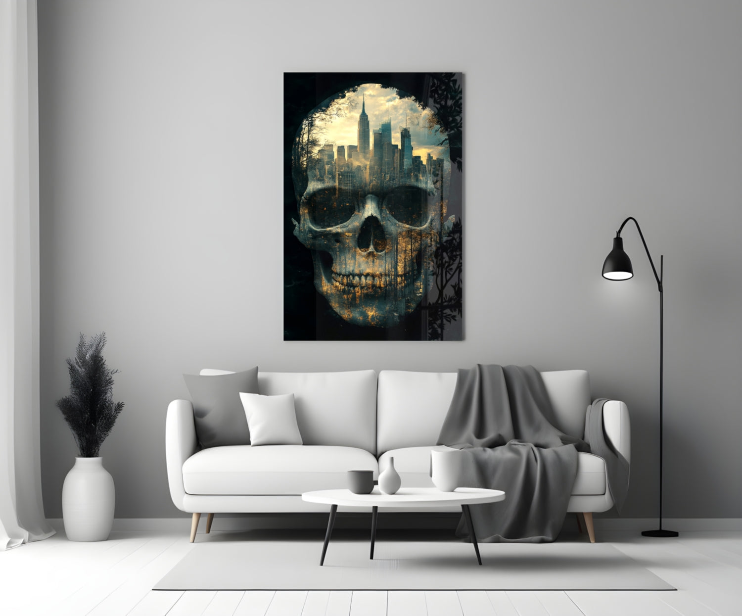 Glass wall art featuring a skull with a cityscape skyline visible through the eye sockets, displayed above a white sofa in a modern living room.