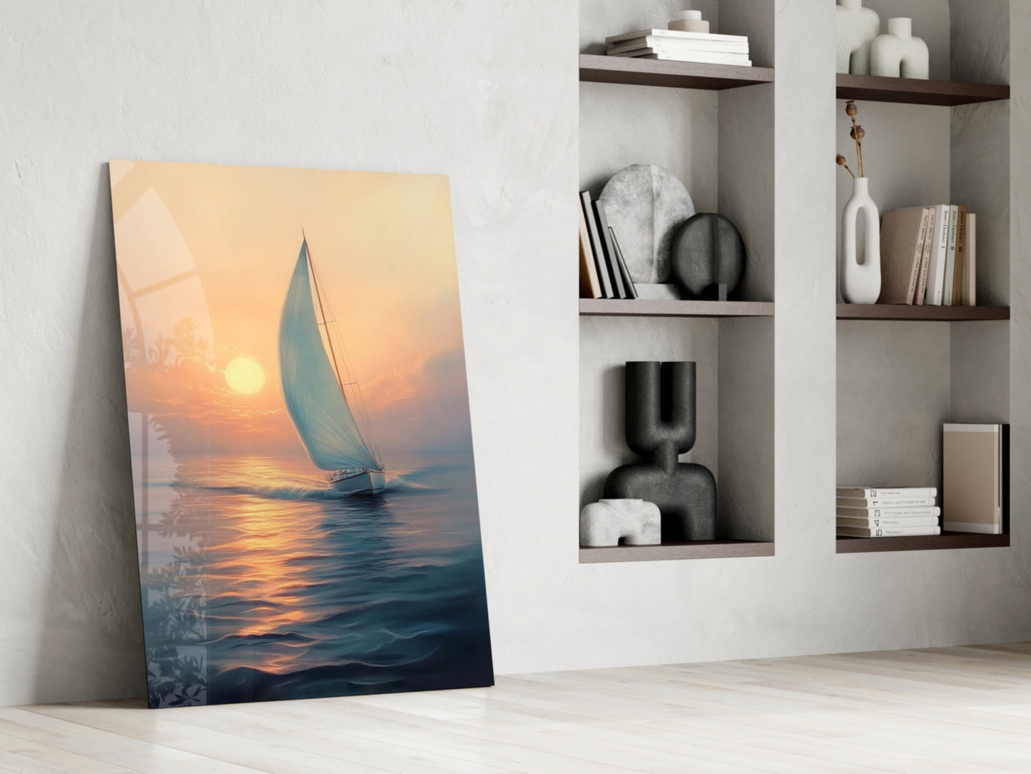 Sailboat glass wall art leaning against white wall beside shelving unit, depicting golden sunset over water with blue sail.