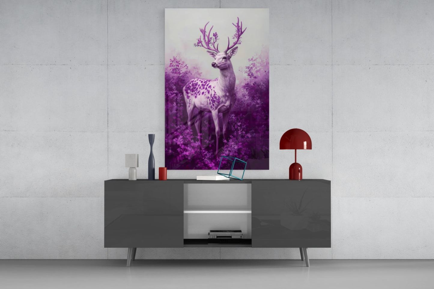 Purple deer glass wall art mounted above gray media console, surrounded by decorative objects and red lamp in modern interior setting.