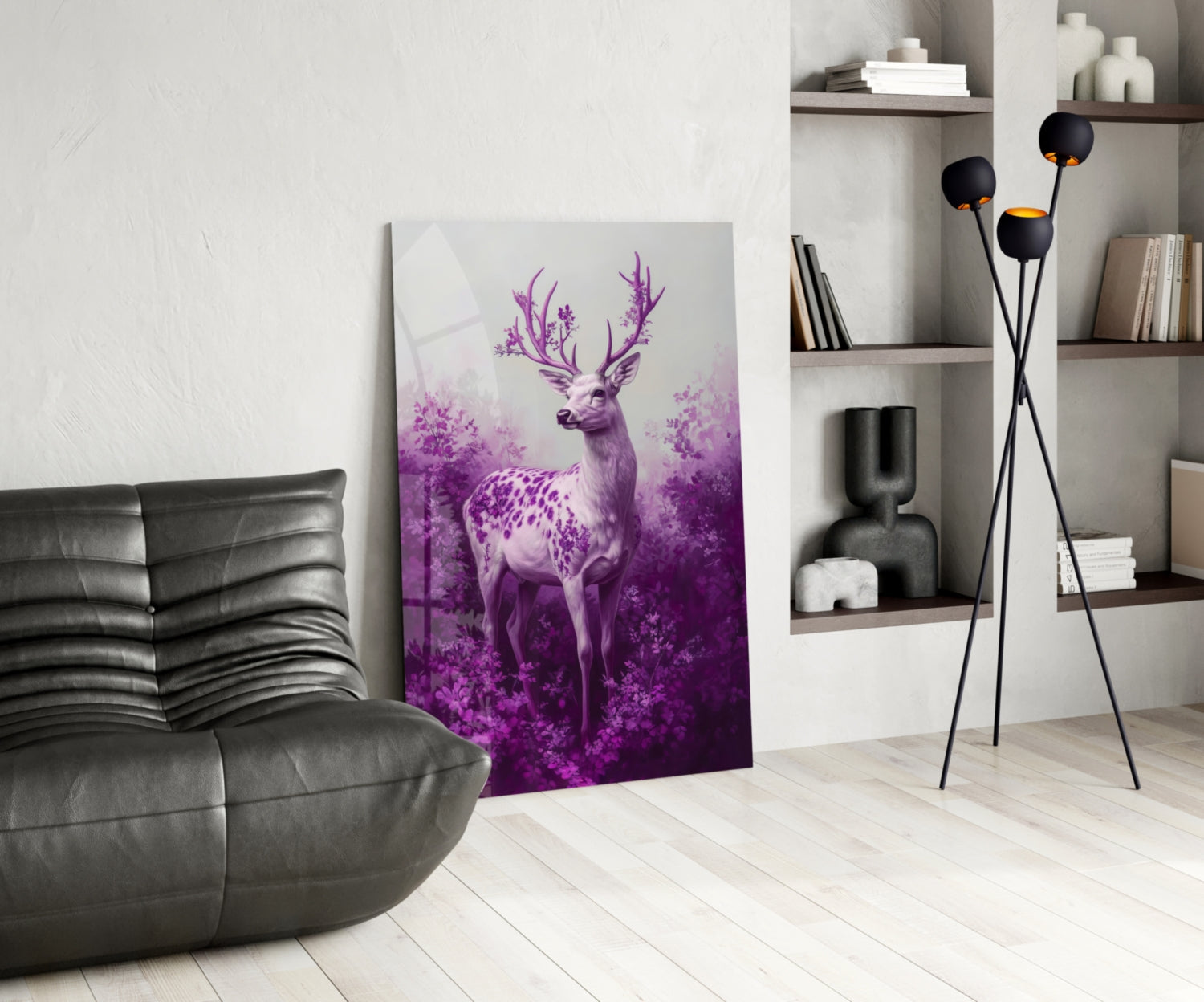 Purple deer glass wall art leaning against wall in modern living room with gray sofa and shelving.