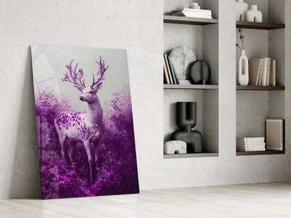 Purple gradient deer glass wall art leaning against white wall next to white shelving unit with decorative objects.