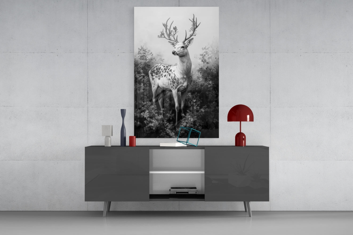 Monochrome deer glass wall art displayed above a dark gray console table with red and white decorative accessories in a modern interior setting.