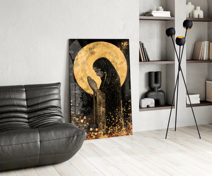 Golden Prayers of Mary glass wall art displayed in modern living room with black leather chair, shelving unit, and tripod floor lamp.