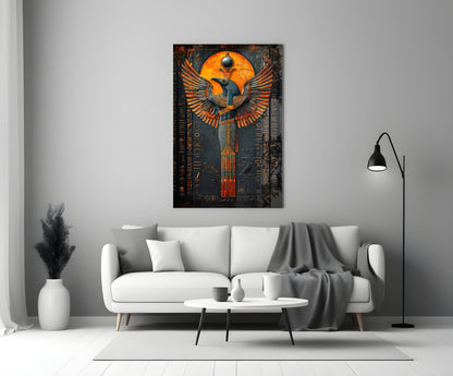 Egyptian-inspired winged deity glass art in orange and gold tones displayed above a white sofa in a modern living room.