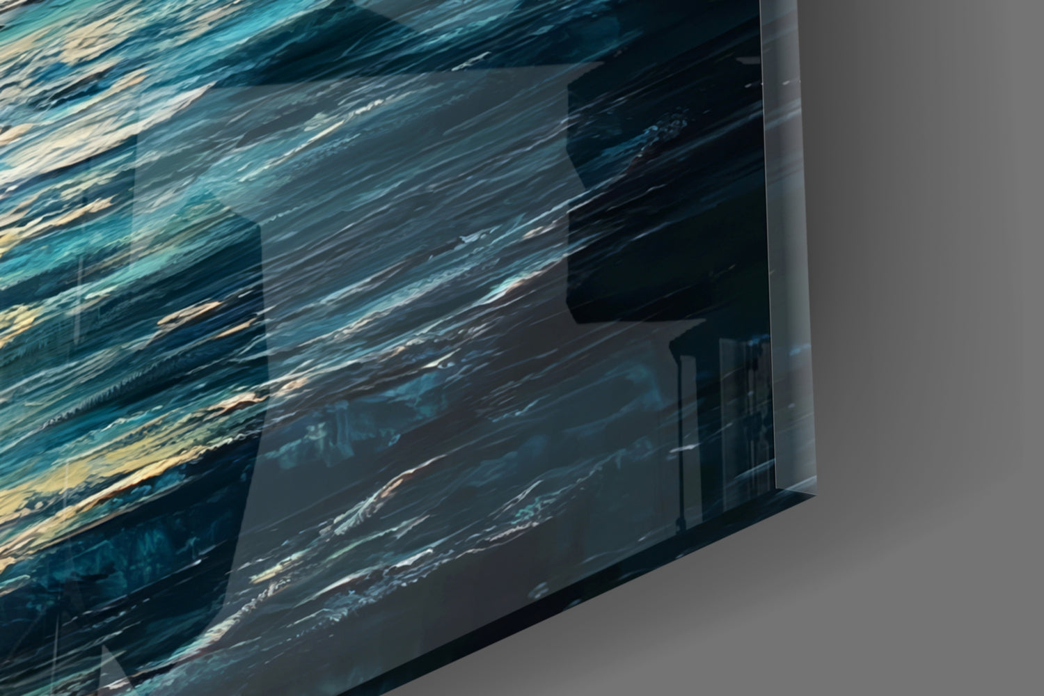 Close-up angled view of translucent glass wall art showing layered blue and teal water texture with gold accents.