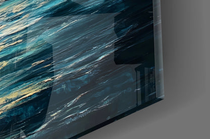 Close-up angled view of translucent glass wall art showing layered blue and teal water texture with gold accents.