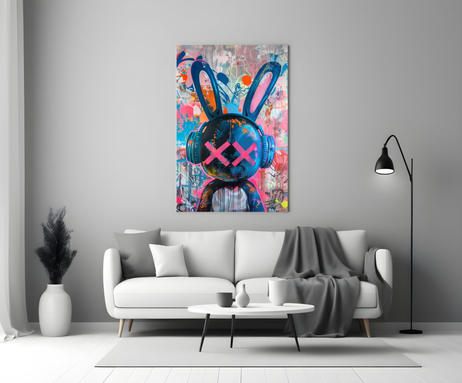 Colorful graffiti rabbit glass art with pink X eyes and headphones displayed above white sofa in modern living room.