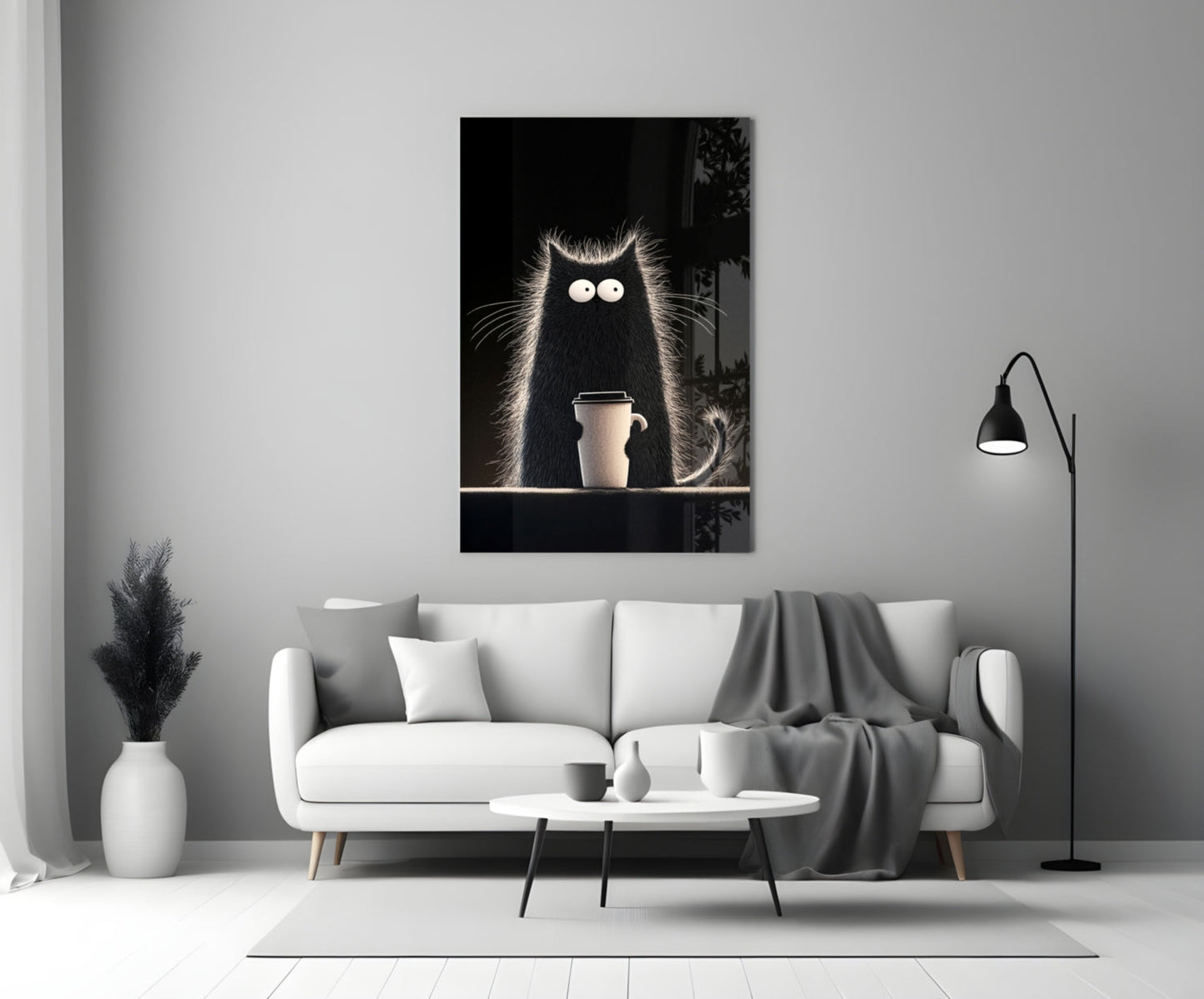 Black cat glass wall art with large white eyes holding coffee cup, displayed above white sofa in minimalist living room.